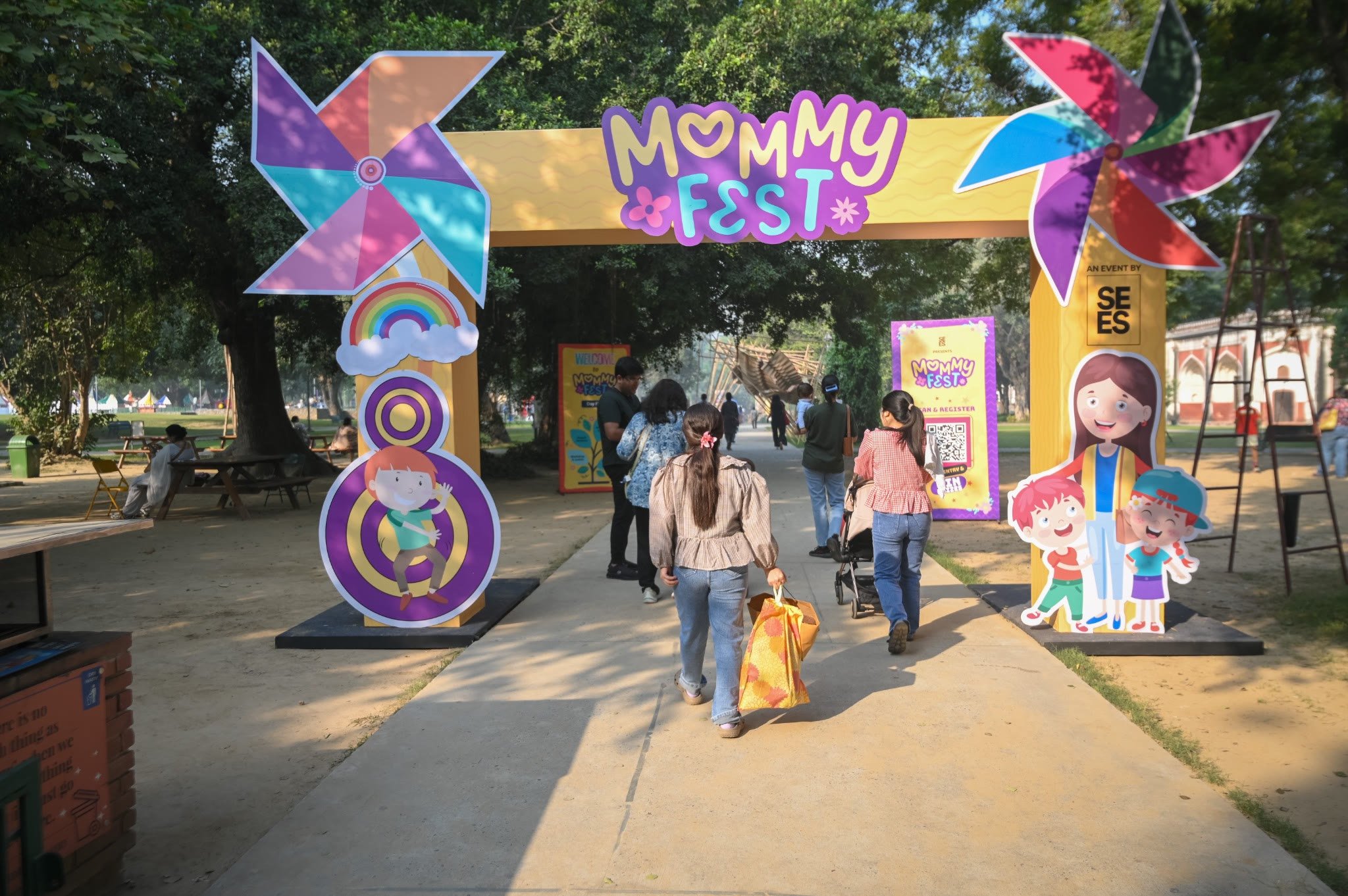 Families walking through the colourful MommyFest entrance